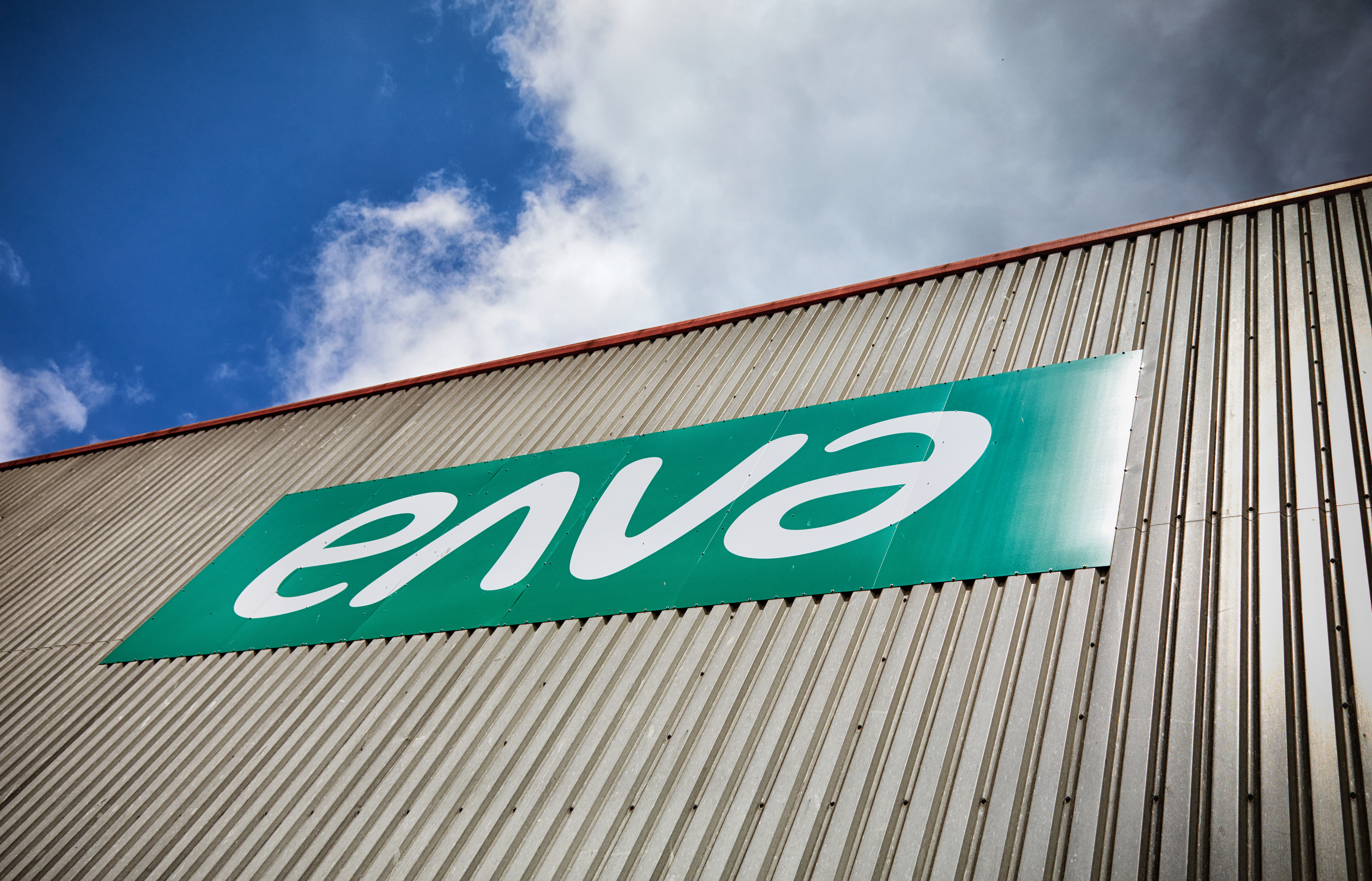 Large Enva sign on exterior of industrial structure.