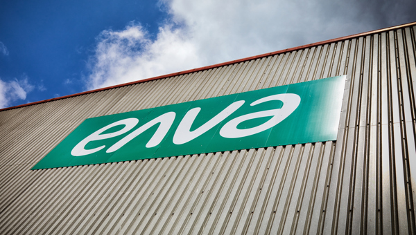 Large Enva sign on exterior of industrial structure.